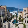 Luxury waterfront two-bedroom apartment, 148 m2, with a sea view, swimming pool and garage, in the harbor Porto Montenegro in Tivat, Montenegro.