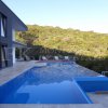 Spectacular villa, 190m2, nestled on a hill, with a breathtaking view of the Bay of Buljarica and the surrounding mountains, just three minutes walk from the sea.