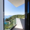 Luksuzna i moderna vila, 331,41m2, sa bazenom i prekrasnim pogledom na otvoreno more, iznad plaže Mogren, u Budvi, Crna Gora.
