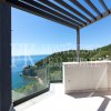 Luxury and modern villa, 438,44 m2, with swimming pool and breathtaking view of the open sea, above the Mogren Beach, in Budva, Montenegro.