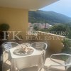 Excellent, furnished apartment in Budva, 95m2, with a panoramic view of the city, the sea and the Sveti Nikola island, in Montenegro.