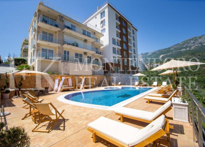 *Excellent apartment in Budva - Becici, 51m2 + 57m2 roof terrace with Jacuzzi and panoramic sea views, in Montenegro.