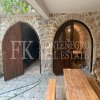 Renovated stone townhouse of the 17th century, 173 m2, in Budva-Chelobrdo, with a sea view and a garden, in Montenegro.