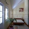 Nice price! Sunny house, 234.37 m2, in a quiet area above Budva, with garden, garage and nice view to a valley, in Montenegro.