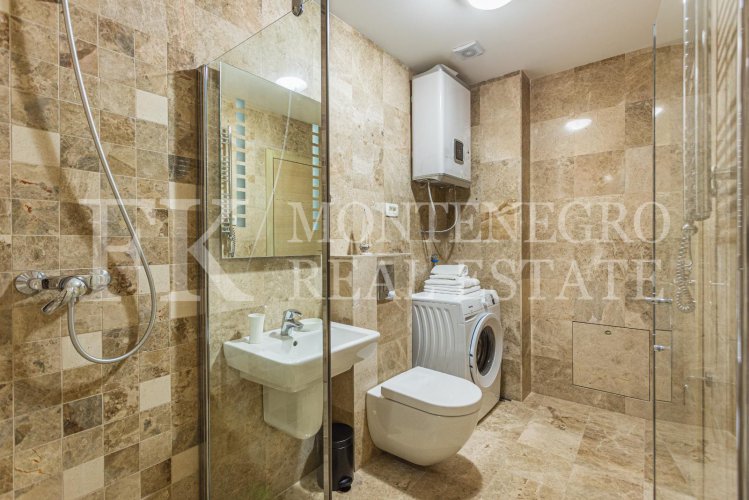 Excellent one bedroom apartment in Budva-Przno, 87m2, with own parking space, only 4 minutes’ walk to the beach, in Montenegro.