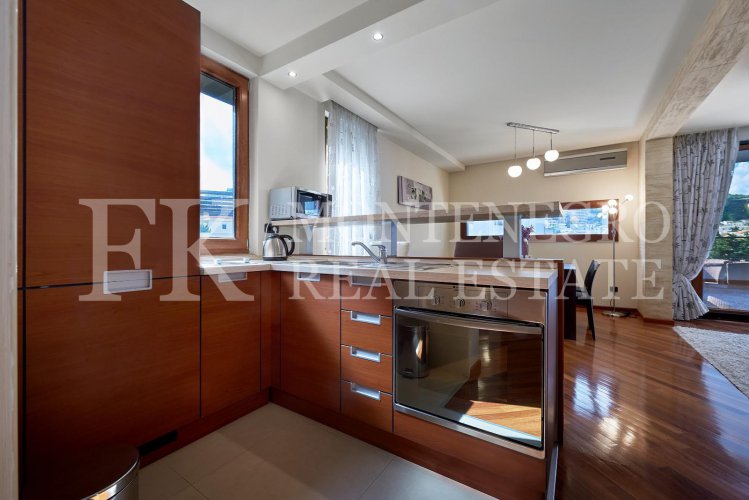 Excellent furnished apartment in the center of Budva, 116m2, with underground parking, in close proximity to the sea, in Montenegro.
