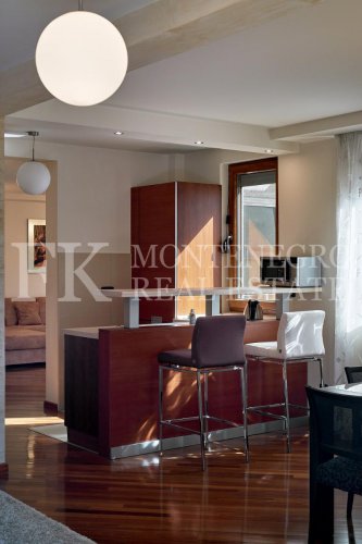 Excellent furnished apartment in the center of Budva, 116m2, with underground parking, in close proximity to the sea, in Montenegro.