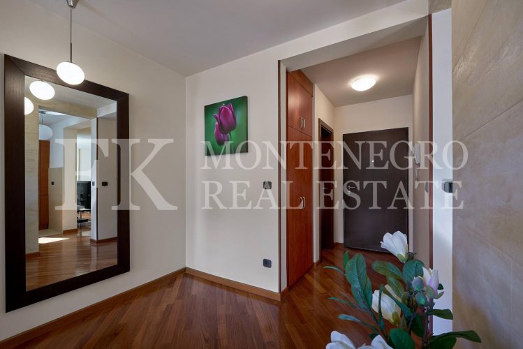 Excellent furnished apartment in the center of Budva, 116m2, with underground parking, in close proximity to the sea, in Montenegro.