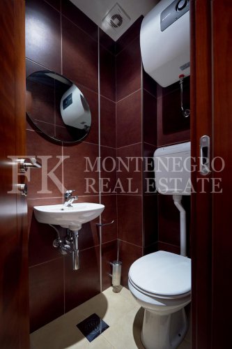 Excellent furnished apartment in the center of Budva, 116m2, with underground parking, in close proximity to the sea, in Montenegro.