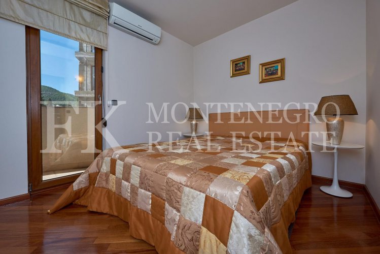 Excellent furnished apartment in the center of Budva, 116m2, with underground parking, in close proximity to the sea, in Montenegro.