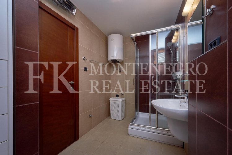 Excellent furnished apartment in the center of Budva, 116m2, with underground parking, in close proximity to the sea, in Montenegro.