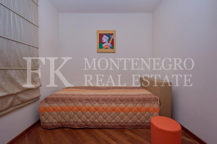 Excellent furnished apartment in the center of Budva, 116m2, with underground parking, in close proximity to the sea, in Montenegro.