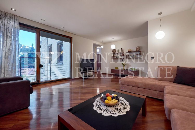 Excellent furnished apartment in the center of Budva, 116m2, with underground parking, in close proximity to the sea, in Montenegro.