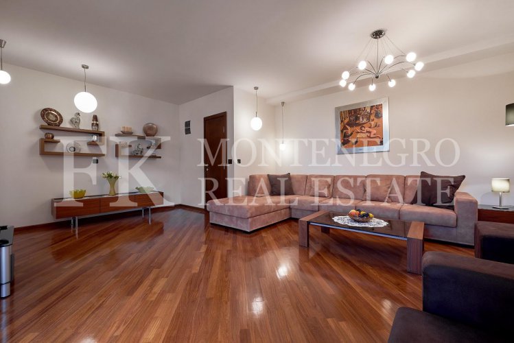 Excellent furnished apartment in the center of Budva, 116m2, with underground parking, in close proximity to the sea, in Montenegro.