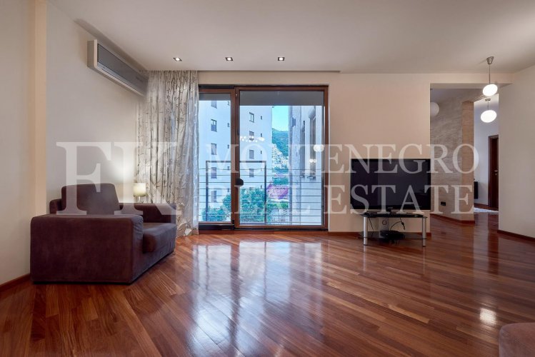 Excellent furnished apartment in the center of Budva, 116m2, with underground parking, in close proximity to the sea, in Montenegro.