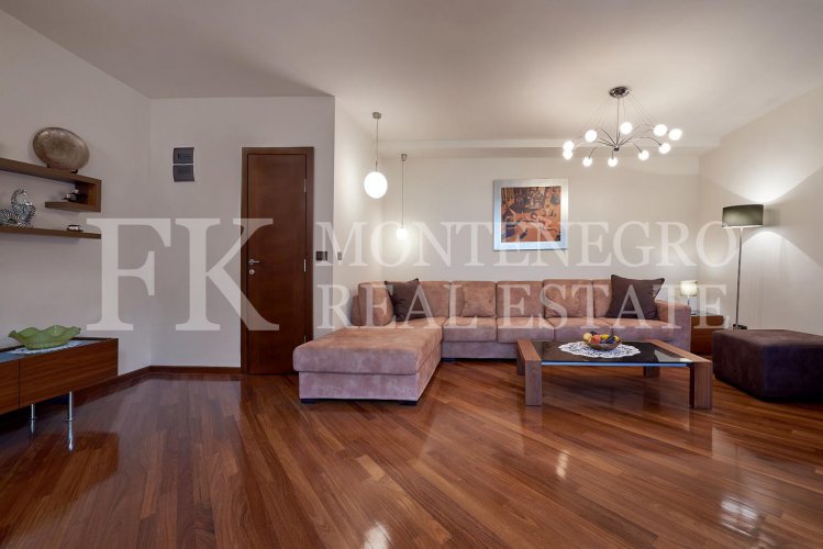 Excellent furnished apartment in the center of Budva, 116m2, with underground parking, in close proximity to the sea, in Montenegro.