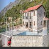 Luxury villa in the traditional Pashtrovsky style, 466m2, above Petrovac in the village of Krushevica, with fantastic sea view, in Montenegro.
