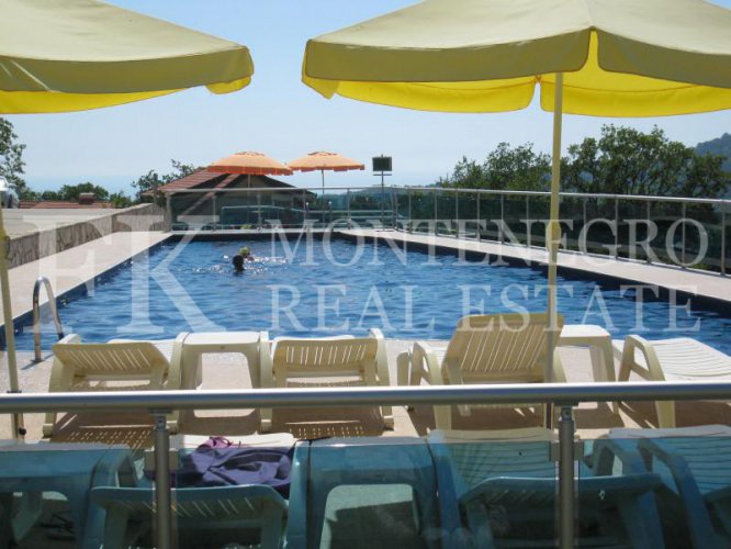 Semi-detached house, 132m2, above Bar, in a beautiful complex of villas in the village area Zupci, with sea view, swimming pool plus two garages, in Montenegro.