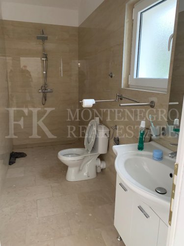 This newly built house with 143 sqm and an additional guesthouse (51 sqm) offers a prime location, just 330 meters from the coast, with an impressive panoramic view of the Bay of Kotor and the surrounding mountains.