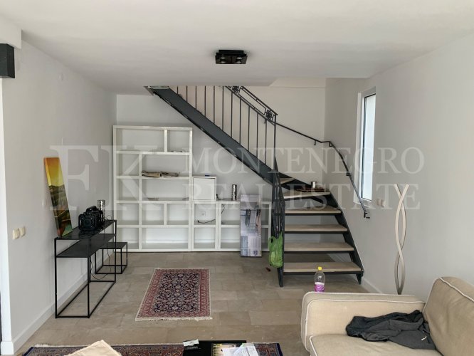 This newly built house with 143 sqm and an additional guesthouse (51 sqm) offers a prime location, just 330 meters from the coast, with an impressive panoramic view of the Bay of Kotor and the surrounding mountains.