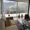 This newly built house with 143 sqm and an additional guesthouse (51 sqm) offers a prime location, just 330 meters from the coast, with an impressive panoramic view of the Bay of Kotor and the surrounding mountains.