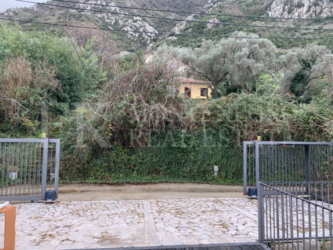 This newly built house with 143 sqm and an additional guesthouse (51 sqm) offers a prime location, just 330 meters from the coast, with an impressive panoramic view of the Bay of Kotor and the surrounding mountains.