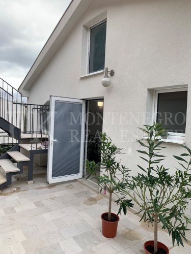 This newly built house with 143 sqm and an additional guesthouse (51 sqm) offers a prime location, just 330 meters from the coast, with an impressive panoramic view of the Bay of Kotor and the surrounding mountains.